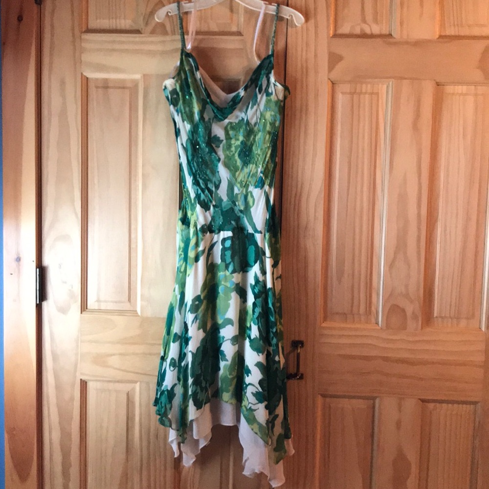 Elegant dress with beaded straps and decor.